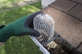 Contractor Installing A Down Spout Filter
