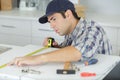 contractor installing laminate counter top during kitchen remodel Royalty Free Stock Photo