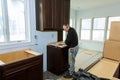 Contractor installing a laminate counter top during a kitchen remodel Royalty Free Stock Photo