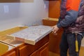 Contractor installing a new laminate kitchen counter top Royalty Free Stock Photo