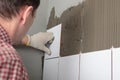 Contractor installing tiles Royalty Free Stock Photo