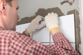 Contractor installing tiles Royalty Free Stock Photo