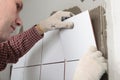 Contractor installing tiles Royalty Free Stock Photo