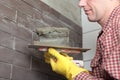 Contractor installing tiles Royalty Free Stock Photo