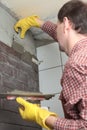 Contractor installing tiles Royalty Free Stock Photo