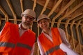 Foreman and construction supervisor posing for camera during house inspection Royalty Free Stock Photo