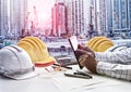 Contractor man working  on office table against construction site project Royalty Free Stock Photo