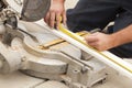 Contractor Measuring for Cutting New Baseboard for Renovation Royalty Free Stock Photo