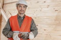 Contractor operating a power tool Royalty Free Stock Photo
