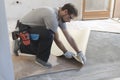 Contractor removing an old linoleum flooring