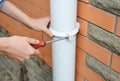 Contractor repair rain gutter downspout pipe. Roundline Guttering, Guttering & Drainage.