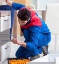 Contractor repairman assembling furniture under woman supervisio Royalty Free Stock Photo