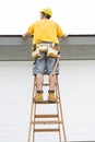 Contractor standing on ladder Royalty Free Stock Photo