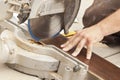 Contractor Using Circular Saw Cutting of New Laminate Flooring