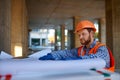 Contractor using digital tablet at construction site Royalty Free Stock Photo