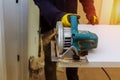 Contractor using a electric saw to cut door boards on the construction of a new home Royalty Free Stock Photo