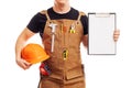 Carpenter in workers apron showing blank clipboard on white background Royalty Free Stock Photo