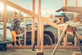 Contractor Worker, His Pickup Truck and the Construction Site Royalty Free Stock Photo