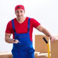 Contractor worker moving boxes during office move Royalty Free Stock Photo