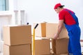 The contractor worker moving boxes during office move