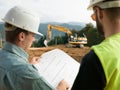 Contractors reading construction plans Royalty Free Stock Photo