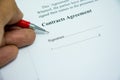 Contracts agreement sign on document paper with red pen Royalty Free Stock Photo