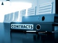 Contracts on Folder. Blurred Image. 3D. Royalty Free Stock Photo