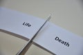 The contradiction between two decisions: Life or Death. Royalty Free Stock Photo