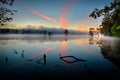 Contrail Colors and Reflection - Cross in the sky Royalty Free Stock Photo