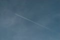 Contrails of aircraft over blue sky