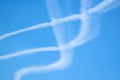 Contrails from airplanes high in the blue sky. Royalty Free Stock Photo