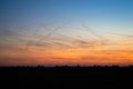 Contrails in the colorful evening sky