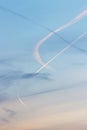 Contrails from several airplanes at sunset Royalty Free Stock Photo