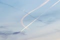 Contrails from several airplanes at sunset Royalty Free Stock Photo