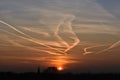 Contrails in the sky at sunset