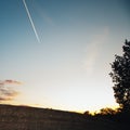 Contrails on Sunset Clear Sky Royalty Free Stock Photo
