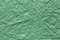Contrast green crumpled wrapping paper texture. Background for handcrafts, Saint Patrick's Day, new year designs Royalty Free Stock Photo