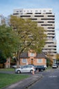 Contrast of Modern High-rise and Traditional Home