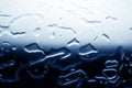 Contrast pattern spilled water texture background, white to dark blue color gradient, water drops on glass surface close up