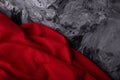 Contrast with red fabric on dramatic gray swirl background