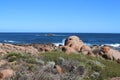 Contrast of red rocks and the blue ocean and sky at the Western Australian coast in the Leeuwin-Naturaliste National Park