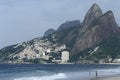 Contrast between richness and poverty: Ipanema beach and favela, Rio de Janeiro, Brazil. Royalty Free Stock Photo