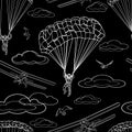 Contrast seamless pattern of contour white figures of parachutists, sports aircraft, birds and clouds on black background