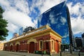 The contrasting architecture of Shed 13 and the Deloitte building, Wellington, New Zealand Royalty Free Stock Photo