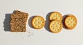 Contrasting Crackers: Seeded Flatbread and Round Butter Crackers on White Background Royalty Free Stock Photo