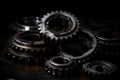 Contrasting image of shiny new gear wheels against a worn-out, dark industrial background, representing innovation and progress