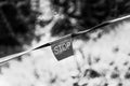 Contrasting light and dark side with stop sign. Inscription STOP. Black and white photo