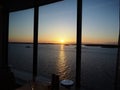 contrasting light, view through the large window of a cruise ship in a restaurant at sunset in the Norwegian fjords. Cruise liner Royalty Free Stock Photo