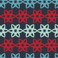 Contrasting red blue flower on a dark background symmetrical geometric seamless pattern Royalty Free Stock Photo