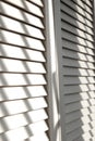 Contrasting shadows on louvered doors Royalty Free Stock Photo